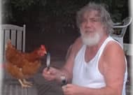 Acclaimed humorist and author Goerge East eating chicken