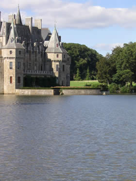 Chateau surrounded by golf course with lake in front. Missillac, Pays de la Loire