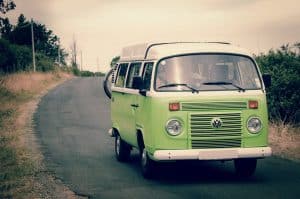 Green combi van on road