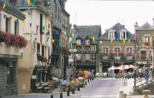 Josselin town centre with half-timbered buildings, street cafes