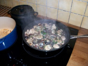 Wild Mushrooms frying in a pan
