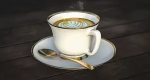 Milky coffee in white cup and saucer
