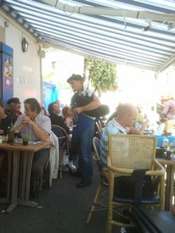Bagpipe playing restaurant owner in Piriac-sur-Mer