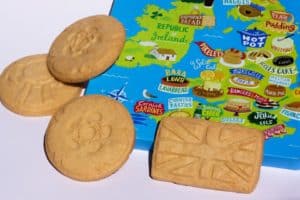 Biscuits on top of corner of map of Britain showing local delicacies and dishes